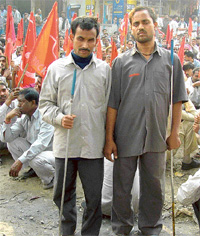 Surinder Pal and Remesh Chander, both visually impaired, who worked at Rockman Cycles