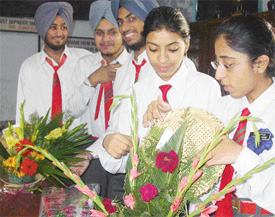 Students of New Senior Secondary School arrange flowers at the flower arrangement competition held on Friday