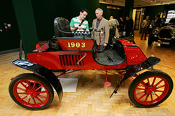 Members of the public view a 1903 Rambler 6.5 HP model at Bonhams auction house in London on Saturday. The classic car is expected to fetch between 35,000 and 40,000 at an auction. 