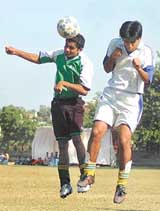 A player of the Khalsa Academy tries to score a goal against Govt Model School, Sector 26, Chandigarh, during the third Kanwar Harbans Lal Memorial Football Tournament at the Football Grounds, Sector 17, Chandigarh on Saturday.