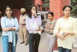 The girls who were staying as paying guests in a Sector 34 house at the police station in Chandigarh on Saturday. 