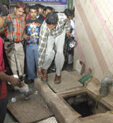 Delhi Police security personnel searching for a bomb at Palika Bazar in the Capital on Saturday