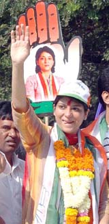 Congress candidate from Mumbai North-West Parliamentary constituency and daughter of late actor Sunil Dutt, Priya Dutt, waves to the crowd at her first election campaign rally in Mumbai on Sunday