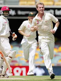 Brett Lee celebrates the dismissal of Devon Smith of the West Indies on the fourth day of the first Test in Brisbane on Sunday. 