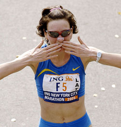 Jelena Prokopcuka of Latvia blows a kiss after she won the New York City Marathon in New York on Sunday. Pokopcuka won the women's division in 2hr 24min 42sec