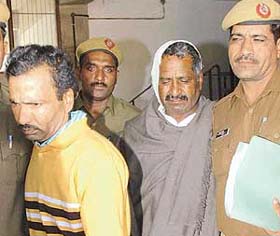 Kashmira Singh and Sadhu Singh, the main accused in Hangola double murder case, being produced in the Panchkula district courts