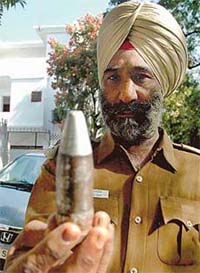 A policeman holds an object suspected to be a bomb in Sector 21, Chandigarh