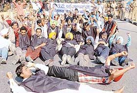 Unemployed ETT teachers hold a protest at Matka Chowk, Sector 17, in Chandigarh