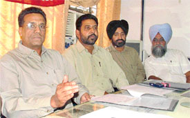 Mr Balwinder Singh, district secretary, and Mr Balbir Singh, circle secretary, BSNL Employees Union, address a news conference in Ludhiana on Tuesday