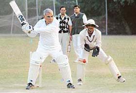 Haryana Chief Minister Bhupinder Singh Hooda plays cricket at DAV College, Sector-10, Chandigarh