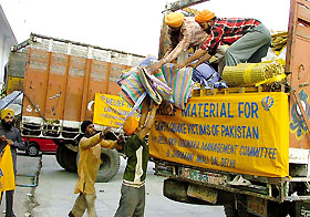 Sevadars at Gurdwara Rakabganj in the Capital loading relief material for earthquake victims in Pakistan on Wednesday