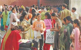 Students wait for submitting forms for admission to LL.B courses at Regional Centre of Panjab University at Extension Library in Ludhiana