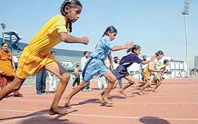 Girls at the starting point of the 100 m race on the second day of the 24th Punjab State Inter-District Primary School Games in Ludhiana