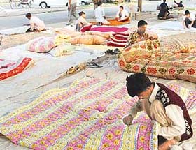 Craftsmen give final touches to quilts as customers get ready for the winter ahead