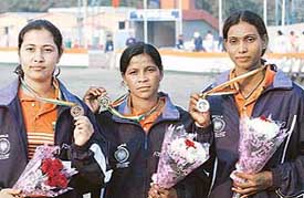 Hansda Jhanu, gold, Besra Sakro, silver, and Bansaralin Dhar, bronze, pose with their medals in womens compound individual division during the 14th Asian Archery Championship