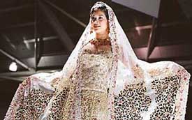 A model presents a creation by Indian designer Devki Karer for label Devkis at a fashion show during the Asian Fashion Week (AFW), 2005, in Singapore on Thursday.