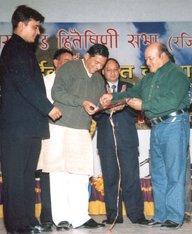 K.C. Baba, MP felicitating Bachu Singh Raman, MP, on the occasion of Uttaranchal Sthapana Divas in the Capital