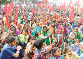 Families of workers rendered jobless after the closure of cycle divisions of Rockman and Highway join protest against the closure in Ludhiana on Thursday