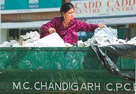 This rag-picker continues to search through this pile, maybe for a better future