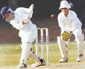The Guru Nanak Academy-36 wicketkeeper all set to catch the ball during a St. Johns cricket trophy match at schools grounds on Friday