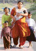 Long story of struggle: Sunita with her four daughters in Sector 7, Chandigarh, on Friday
