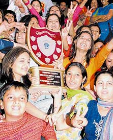 Apeejay College team displays the trophy it won in the festival in Jalandhar on Friday