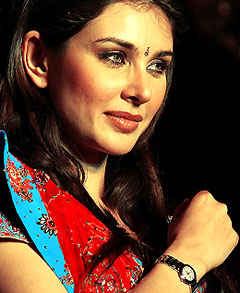 Model and Rado brand ambassador Lisa Ray poses with one of the Rado Couple watches in New Delhi on Friday night