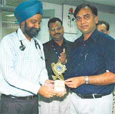 Dr G.S. Wander, Director, Hero DMC Heart Institute, felicitates Dr Rajesh Araya in Ludhiana