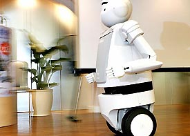 Japanese electronics giant Hitachis two-wheel robot Emiew runs with a maximum speed of 6 kph during a demonstration