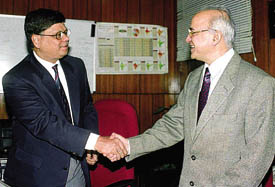 The outgoing MCD Commissioner, Rakesh Mehta, shakes hand with the new MCD Commissioner, Ashok Kumar, in the Capital on Monday