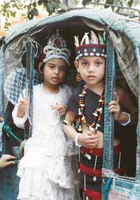 Schoolchildren on their way to participate in a fancy dress competition in Ludhiana on Monday