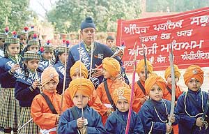 Students of Ambika Public School, Kharar, take part in a nagar kirtan organised in connection with the birth anniversary of Guru Nanak Dev.