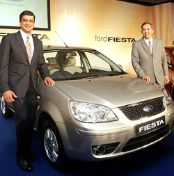 Director and President of Ford India Arvind Mathew and the Vice-President, Marketing, Sales and Service, Mr V. Sivaramakrishnan pose in front of a Ford Fiesta car during its launch in New Delhi on Tuesday