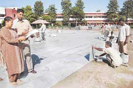 Ms Madhu Bahl, Principal of KB DAV Centenary School, Sector 7, reviews the construction work of the new flat track for speed skaters on her school premises on Tuesday.