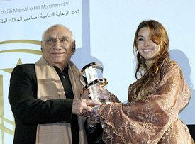 Film director Yash Chopra receives an award for his lifetime career at the fifth Marrakesh International Film Festival in Marrakesh Morocco, on Monday. 
