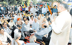 Punjab BJP President Avinash Rai Khanna addresses party workers before submitting a memorandum to the Deputy Commissioner in Jalandhar on Wednesday. 