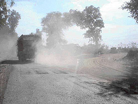 A cloud of dust hangs on the Pathankot-Mukerian road due to the pollution caused by stone crushing units. 