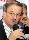 Chairman of US company International Truck and Engine Corporation Daniel Ustain (left) addresses a press conference as Vice-Chairman of Mahindra and Mahindra Ltd Anand Mahindra (R) looks on, after signing a joint venture agreement in Mumbai
