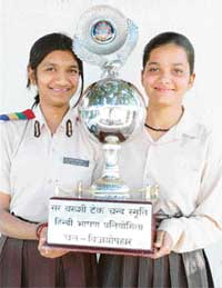 Mani Jain (left) and Deepti of Maj R.N. Kapoor, DAV Public Senior Secondary School, Ambala Cantt, who won the trophy at the Hindi declamation contest at DAV School, Chandigarh, on Thursday. 
