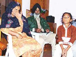 Ms Shinderpal Kaur, wife of Gurjit Singh, and Mr Nihal Singh, father of Gurdeep Singh, at a press conference in Bathinda on Saturday.