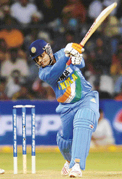 Virender Sehwag plays a shot during the second one-day international in Bangalore on Saturday.