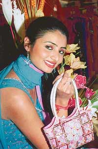 City model Harleen exhibits her party purse in style