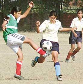 The players vie to get the ball during the Senior Chandigarh Women Football Championship for Deepak Kapania Memorial Trophy held at the Football Stadium, Sector 17, Chandigarh on Sunday