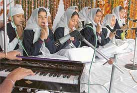 Students of GNI Public School, Ludhiana, recite a shabad at a function organised on the school campus on Sunday to mark Gurpurb