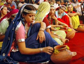 Students of Ramgarhia Girls College await their turn to perform in the Inter-Zone Youth and Heritage Festival on the premises of the college on Sunday