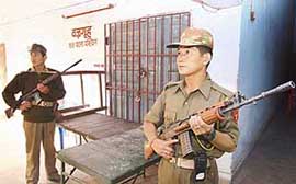 SSB jawans keep a vigil in front of the room in which electronic voting machines are being kept in Patna on Sunday after the end of the last phase of polling on Saturday for the Bihar Legislative Assembly election.