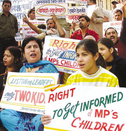 Activists of Surbhi Parivar, an NGO which works for public awareness on family planning, demanding the right to get information about MPs children