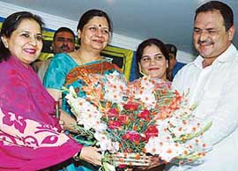 Haryana Chief Minister Bhupinder Singh Hooda's wife Asha Hooda ( second from left) is felicitated by Congress leader Dalip Chawla at a function in Ambala on Monday.