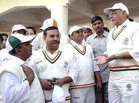 Haryana Chief Minister Bhupinder Singh Hooda interacts with members of the parliamentary cricket team prior to the inauguration of the Surender Singh memorial cricket match between parliamentarians and the Haryana Chief Minister XI, in Gurgaon on Monday.