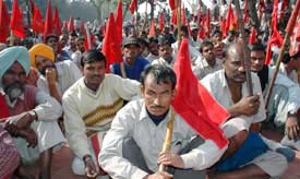 Workers participate in the CPMs dharna in Ludhiana on Monday